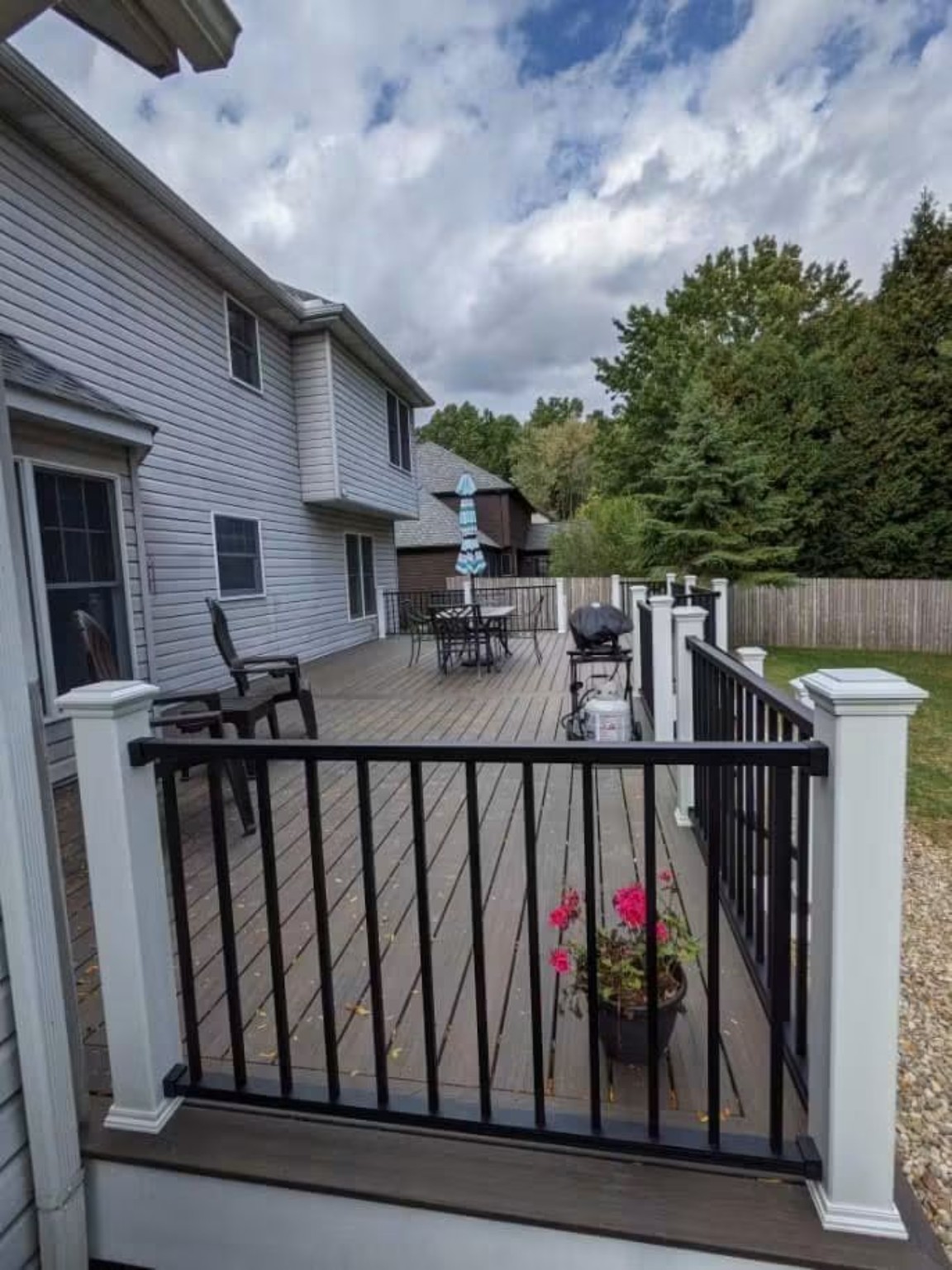 Completed composite deck with black rails and white posts