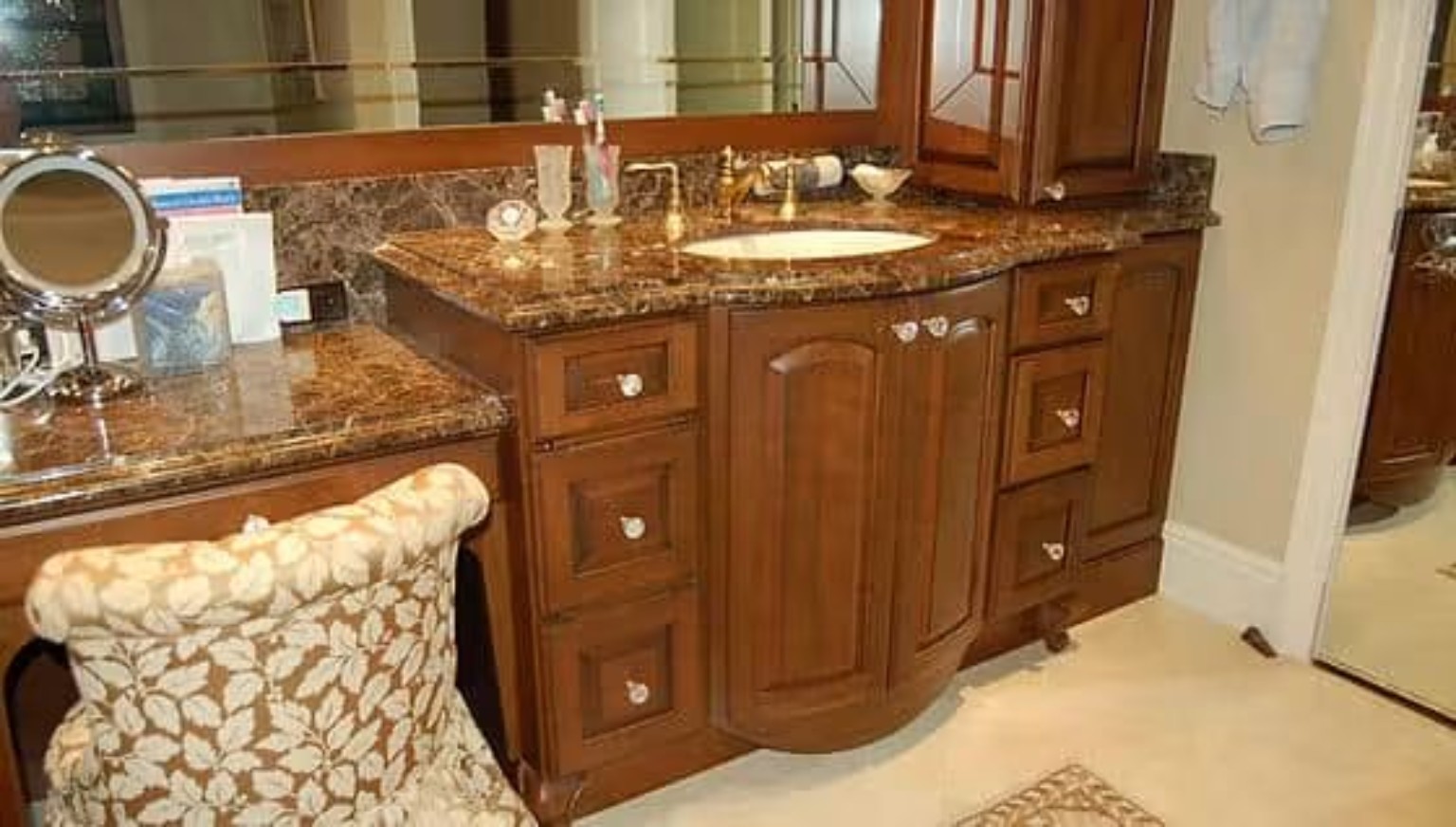 Custom bathroom vanity and cabinetry with stone countertops